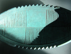 the top view of line patterns in a green bronze center piece